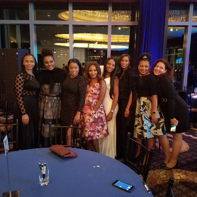 Marvet Britto and Yandy Smith (fourth and fifth from left) surrounded by friends of Britto’s (Danielle Belton/The Root)